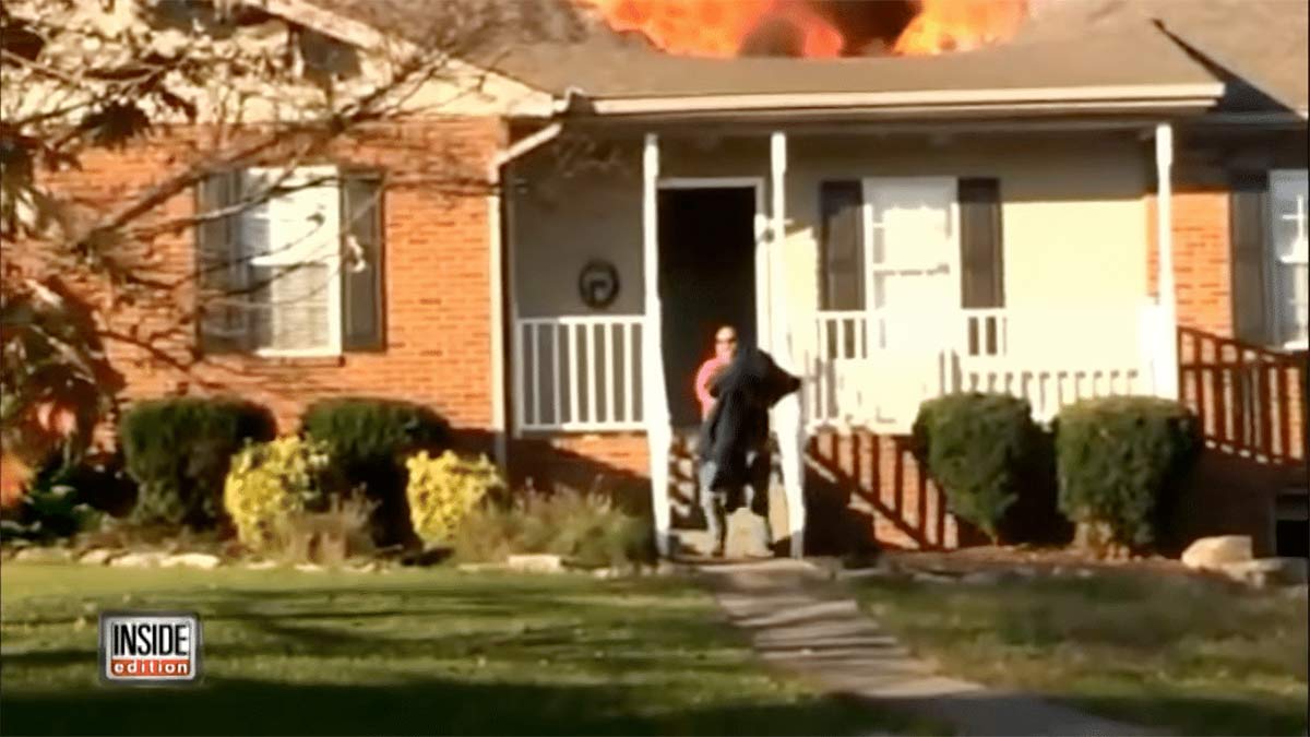 Firefighter saves dog from a burning house