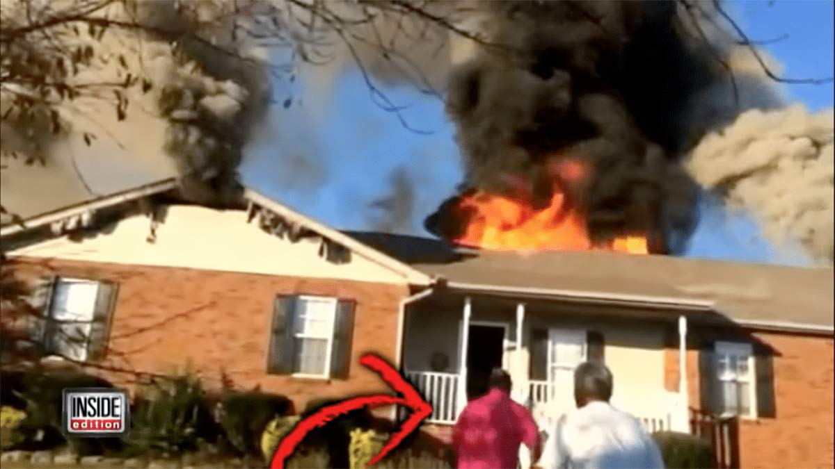 Man driving by a burning house rescues a dog from the fire