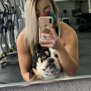 a frenchie working out at the gym